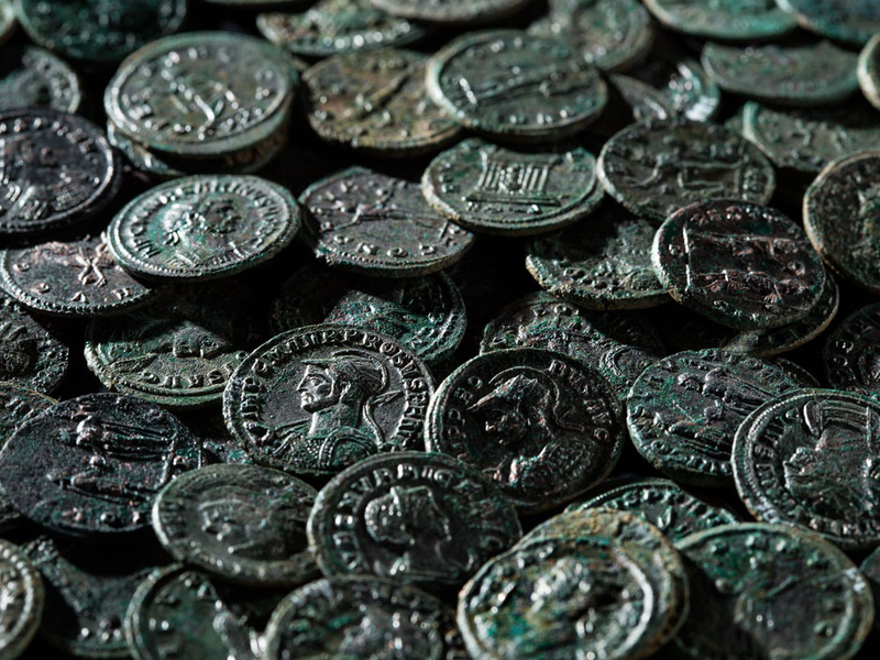 Illustration for article titled Farmer Discovers Priceless Trove of Ancient Roman Coins While Removing a Molehill